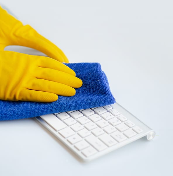 Cleaning keyboard blue cloth and yellow gloves